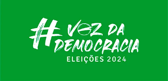 Pra todos verem: marca das Eleições Municipais 2024, com a frase “Voz da Democracia: eleições 2024” e o fundo verde;